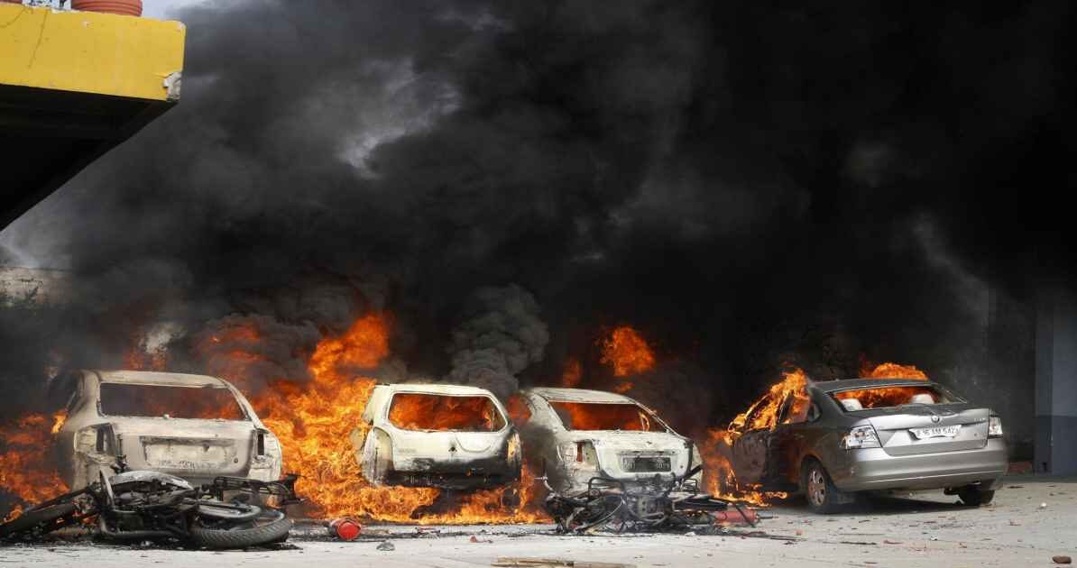 Noida labour protest workers demanding wage hike blocking road