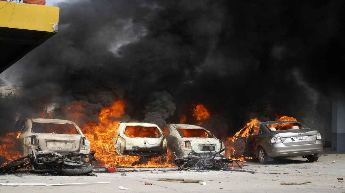 Noida labour protest workers demanding wage hike blocking road